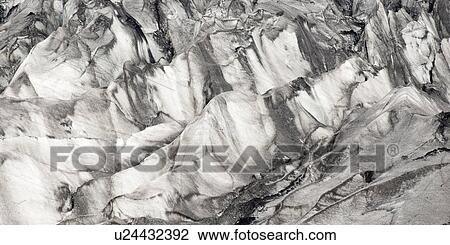 Stock Image - Glacier with many crevasses. Fotosearch