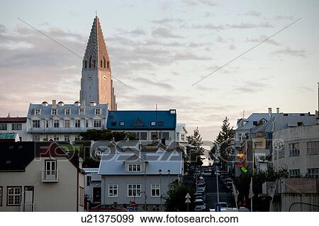 Hallgrimskirkja Church steeple - tallest building in Iceland, surrounded by colourful dwellings at sunset View Large Photo Image Stock Photo - Hallgrimskirkja Church steeple - tallest building in Iceland, surrounded by colourful dwellings at sunset. Fotosearch