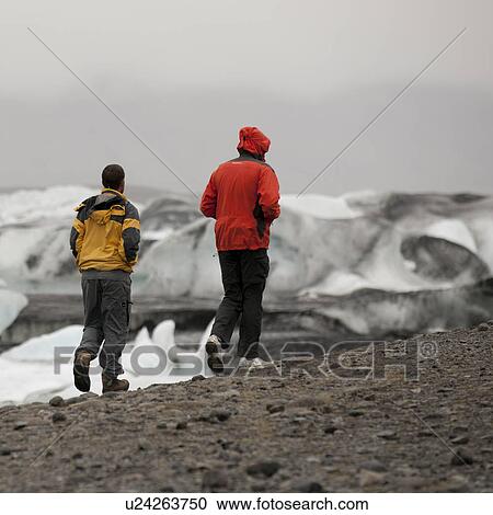 Hikers on moraine on shore of glacial lake View Large Photo Image Stock Image - Hikers on moraine on shore of glacial lake. Fotosearch