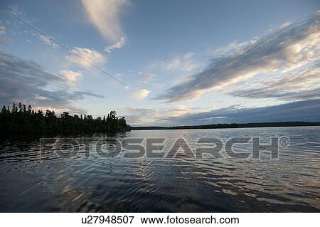 Horizon at dusk at Lake of the Woods, Ontario View Large Photo Image Stock Photo - Horizon at dusk at Lake of the Woods, Ontario. Fotosearch