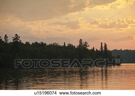 Picture - Horizon at sunset in Lake of the Woods, Ontario. Fotosearch
