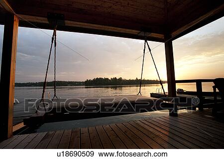 Stock Photo - Horizon at sunset in Lake of the Woods, Ontario. Fotosearch