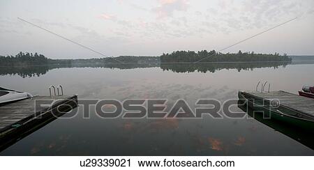 Stock Image - Horizon sky at twilight in Lake of the Woods, Ontario. Fotosearch