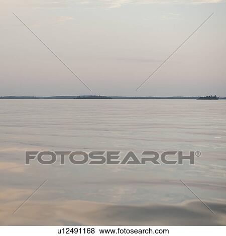 Stock Photo - Horizon sky over Lake of the Woods, Ontario. Fotosearch