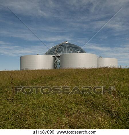 Hot water storage tanks in grassy field under wispy clouds View Large Photo Image Stock Photograph - Hot water storage tanks in grassy field under wispy clouds. Fotosearch