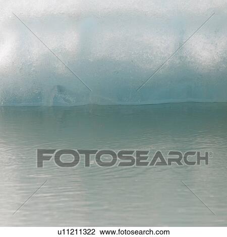 Stock Image - Iceberg in water. Fotosearch