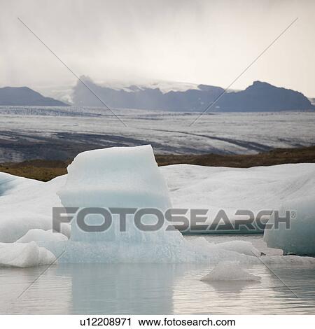 Icebergs floating in the ocean View Large Photo Image Stock Image - Icebergs floating in the ocean. Fotosearch