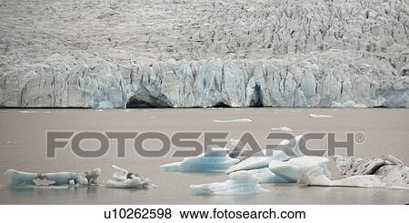 Icebergs floating in the ocean View Large Photo Image Stock Photo - Icebergs floating in the ocean. Fotosearch