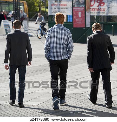 Icelandic men in business suit and jacket walking on the city sidewalk, rear view View Large Photo Image Stock Image - Icelandic men in business suit and jacket walking on the city sidewalk, rear view. Fotosearch