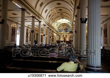 Interior of Metropolitan Cathedral of San Jose with worshippers facing the altar View Large Photo Image Stock Image - Interior of Metropolitan Cathedral of San Jose with worshippers facing the altar. Fotosearch