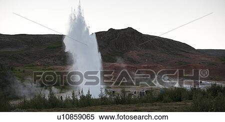 Landscape, geyser exploding before sightseers View Large Photo Image Stock Photography - Landscape, geyser exploding before sightseers. Fotosearch