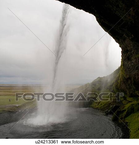 Landscape of farmland from behind water falling into a pool from a cliff View Large Photo Image Stock Image - Landscape of farmland from behind water falling into a pool from a cliff. Fotosearch