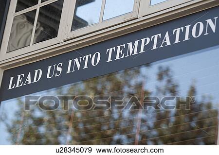 Lead us into temptation - lettering on window pane View Large Photo Image Stock Photo - Lead us into temptation - lettering on window pane. Fotosearch