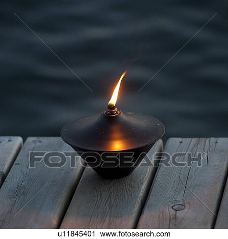 Lit lantern on the dock at Lake of the Woods, Ontario View Large Photo Image Stock Image - Lit lantern on the dock at Lake of the Woods, Ontario. Fotosearch