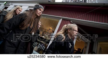 Long hair women walking past sweater shop View Large Photo Image Stock Image - Long hair women walking past sweater shop. Fotosearch