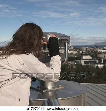 Stock Image - Looking through a viewer at city skyline. Fotosearch