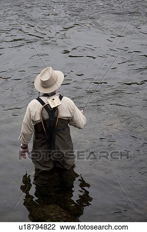 Man fly fishing at lake Taneycomo in Branson, Missouri View Large Photo Image Stock Image - Man fly fishing at lake Taneycomo in Branson, Missouri. Fotosearch