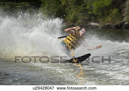 Man on water skiis at Lake of the Woods, Ontario View Large Photo Image Stock Photo - Man on water skiis at Lake of the Woods, Ontario. Fotosearch