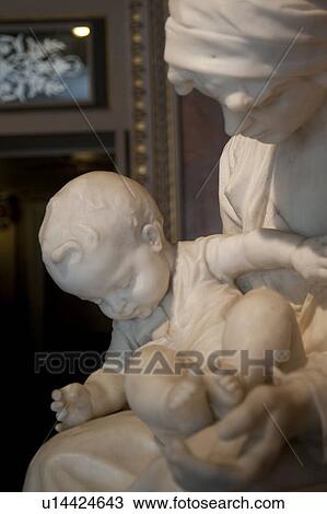Stock Image - Marble sculpture of Virgin Mary and Baby Jesus. Fotosearch