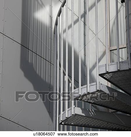 Stock Photo - Metal spiral staircase and shadow. Fotosearch