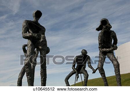 Stock Image - Metal statues of human forms. Fotosearch