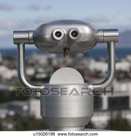 Metalic binocular viewer above city skyline View Large Photo Image Stock Photograph - Metalic binocular viewer above city skyline. Fotosearch