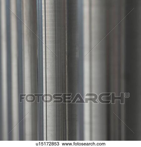 Stock Image - Metalic steel parallel pipes. Fotosearch