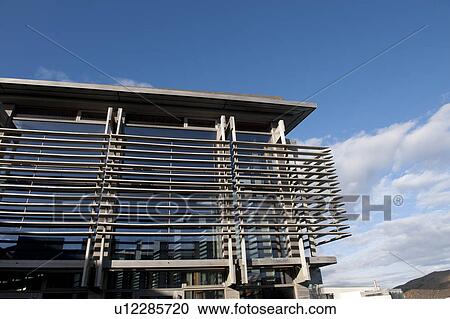 Modern glass and steel highrise building surrounded by horizontal bands View Large Photo Image Stock Image - Modern glass and steel highrise building surrounded by horizontal bands. Fotosearch