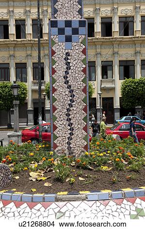 Picture - Mosaic tile snake rising from a flower garden. Fotosearch