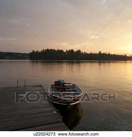 Motorboat at the dock in Lake of the Woods, Ontario View Large Photo Image Stock Image - Motorboat at the dock in Lake of the Woods, Ontario. Fotosearch