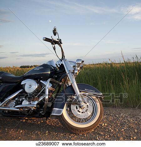 Motorcycle at the edge of the road at Lake of the Woods, Ontario View Large Photo Image Stock Photo - Motorcycle at the edge of the road at Lake of the Woods, Ontario. Fotosearch