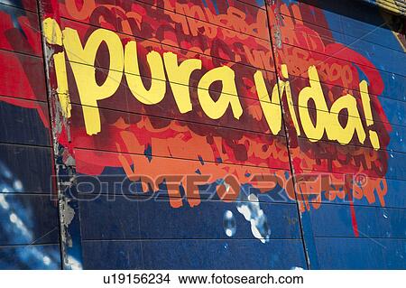 Picture - Mural of beer ad with words "pura vida". Fotosearch
