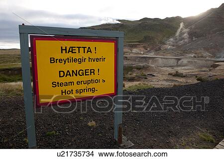 Picture - Orange danger sign warning of steam eruptions and hot springs. Fotosearch