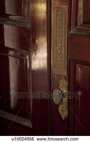 Stock Photo - Ornate brass doorplate and handle. Fotosearch