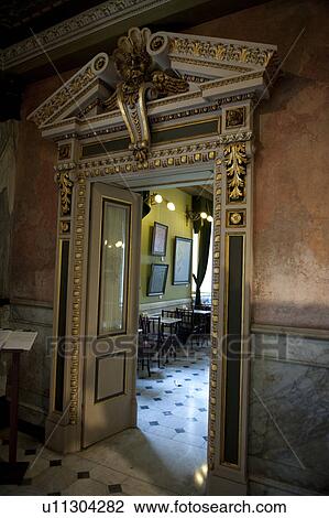 Stock Image - Ornate gilded doorway leading to restaurant with a marble floor at the National Theatre in San Jose. Fotosearch