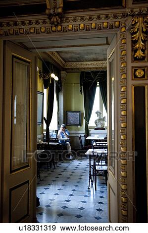 Stock Photo - Ornate gilded doorway leading to restaurant with a marble floor at the National Theatre in San Jose. Fotosearch