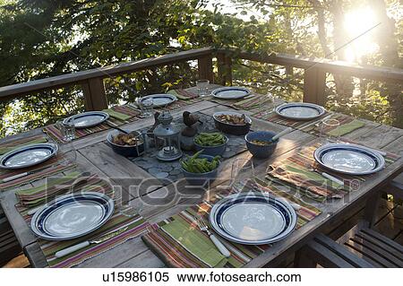 Stock Photography - Outdoor dining table at Lake of the Woods, Ontario. Fotosearch