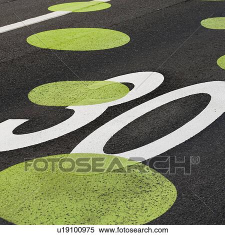 Stock Photography - Painted dots on roadway speed limit. Fotosearch