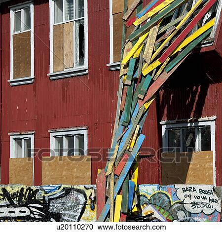 Painted lumber falling from window, with grafitti on structure View Large Photo Image Stock Image - Painted lumber falling from window, with grafitti on structure. Fotosearch
