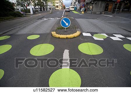 Stock Photo - Pedestrian crosswalk with dots, on paved street. Fotosearch