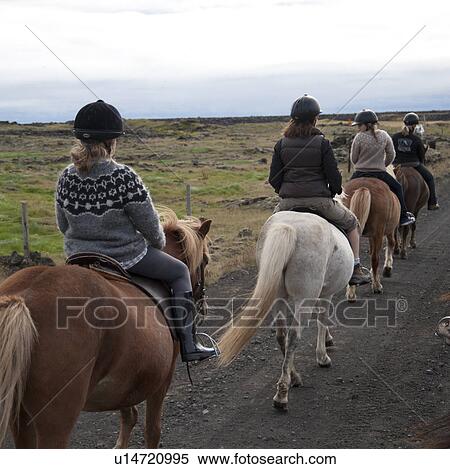 People horseback riding in rural Iceland View Large Photo Image Stock Photography - People horseback riding in rural Iceland. Fotosearch