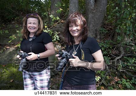 Stock Image - Photographers at lake Taneycomo inBranson, Missouri. Fotosearch
