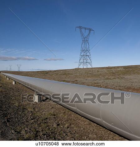 Pipeline through countryside with electrical pylon View Large Photo Image Stock Photo - Pipeline through countryside with electrical pylon. Fotosearch