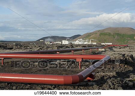 Pipelines snaking towards geothermal powerstation below the mountains View Large Photo Image Stock Image - Pipelines snaking towards geothermal powerstation below the mountains. Fotosearch