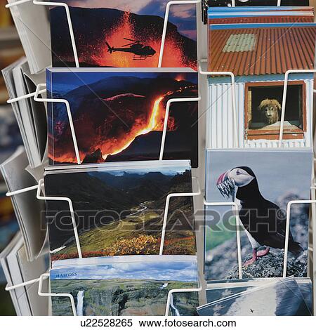 Stock Photography - Postcard rack with photos of Iceland attractions. Fotosearch
