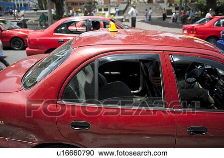 Red taxi cabs on a street in San Jose, Costa Rica View Large Photo Image Stock Image - Red taxi cabs on a street in San Jose, Costa Rica. Fotosearch