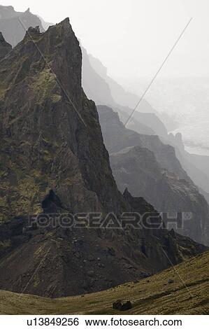 Stock Photograph - Rugged mountainous terrain of South Iceland. Fotosearch