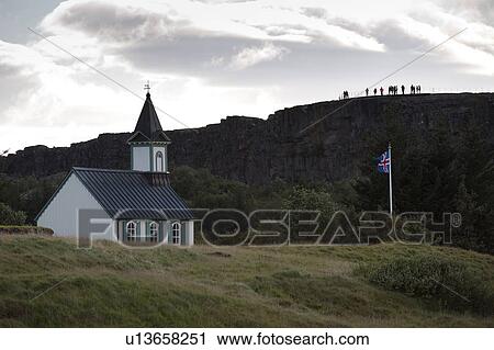 Rural church and flagpole next to hillside View Large Photo Image Stock Image - Rural church and flagpole next to hillside. Fotosearch