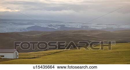 Picture - Rural landscape, rolling hills, glacial mountain range. Fotosearch