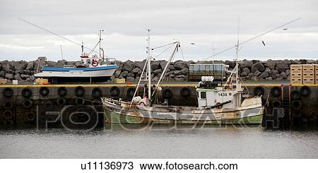 Rusty fishing boat moored at wharf in ocean View Large Photo Image Stock Image - Rusty fishing boat moored at wharf in ocean. Fotosearch